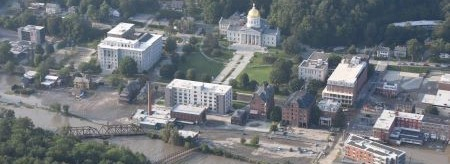 Aerial photo of Montpelier, Vermont with flood waters on streets.