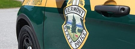 Vermont State Police emblem on the side of a cruiser